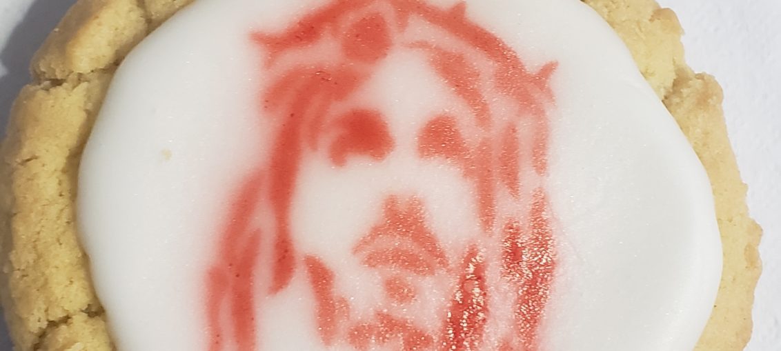 A sugar with an airv=brushed image of Chrrist's bloody face