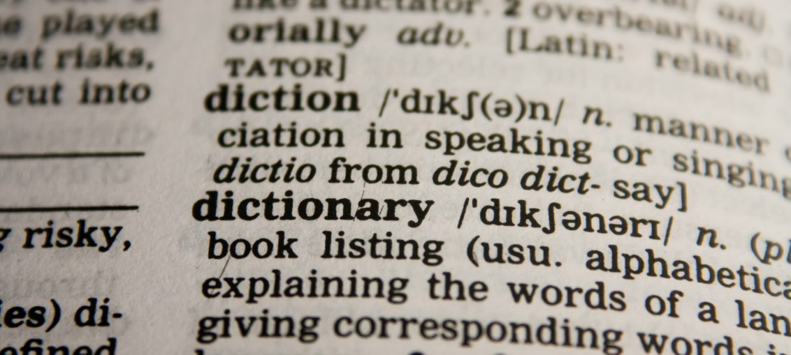 Dictionary opened up to the word "dictionary"