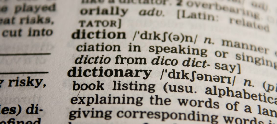 Dictionary opened up to the word "dictionary"