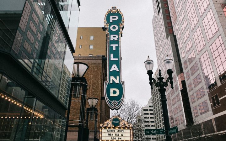 The marquee sign for the Portland Center For The Performing Arts is shown on a downtown Main Street in Portland, Oregon