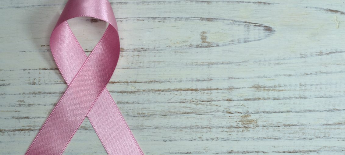 A pink ribbon representing women's cancer awreness