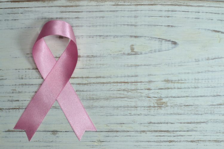 A pink ribbon representing women's cancer awreness