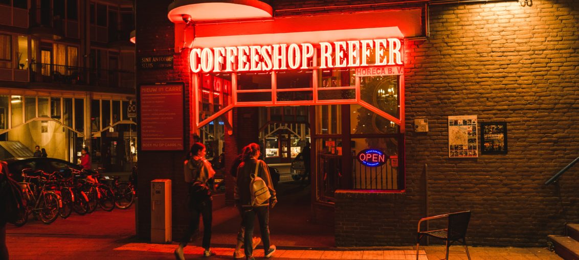 A cannabis cafe in the Netherlands with a neon sigh reading Coffeeshop Reefer