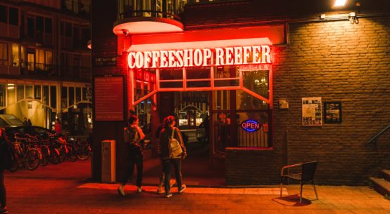 A cannabis cafe in the Netherlands with a neon sigh reading Coffeeshop Reefer