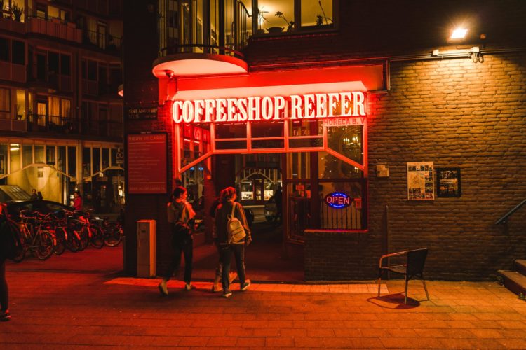 A cannabis cafe in the Netherlands with a neon sigh reading Coffeeshop Reefer