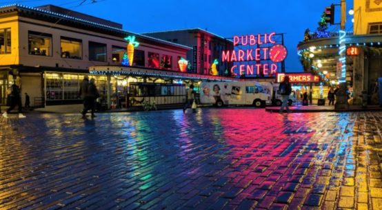 A nighttime photo of the Seattle Public Place Market sign