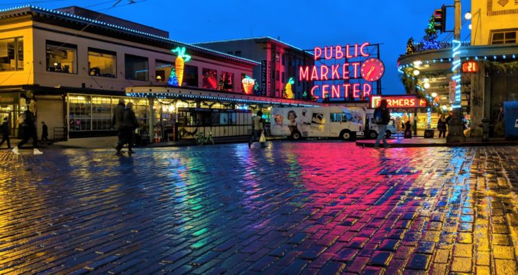 A nighttime photo of the Seattle Public Place Market sign